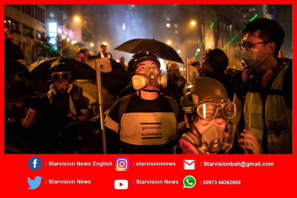 Hong Kong protesters target airport but planes are running