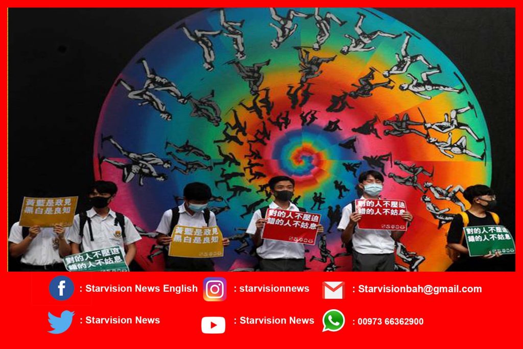 Hong Kong children form chains of protest as economic worries grow