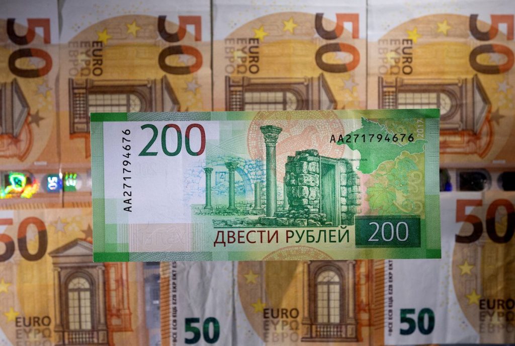 Russian rouble firms past 57 to the dollar for first time in four years