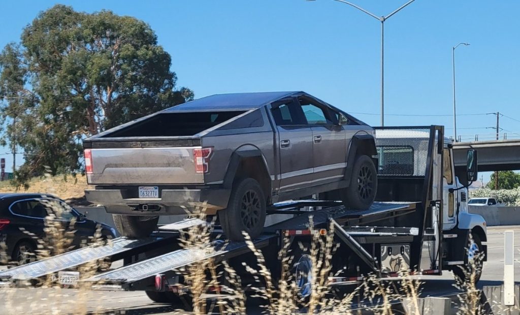 Tesla Cybertruck spotted with Ford F-150 wrap: Report tesla-cybertruck-spotted-with-ford-f-150-wrap:-report