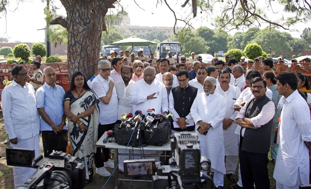 kharge-accuses-bjp-of-trying-to-threaten-opposition,-vows-india-will-keep-on-fighting