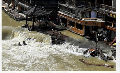At least 10 killed as heavy rains drench southern, central China